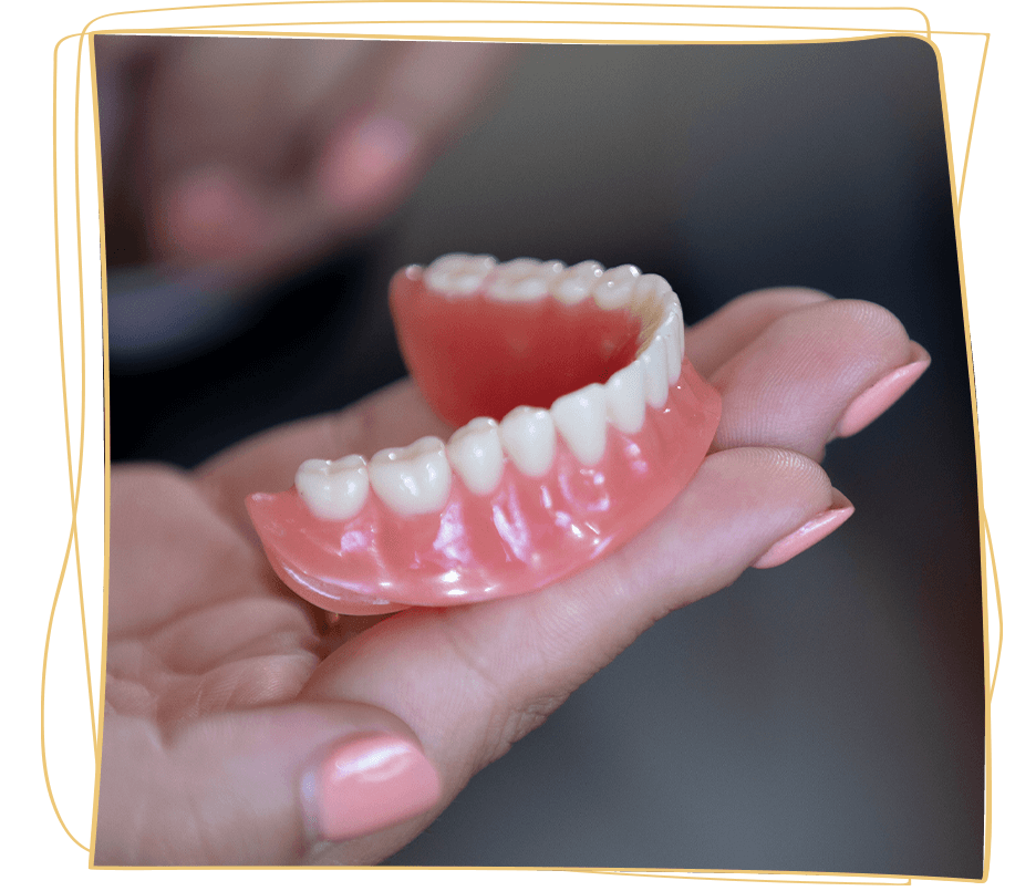 denture being held
