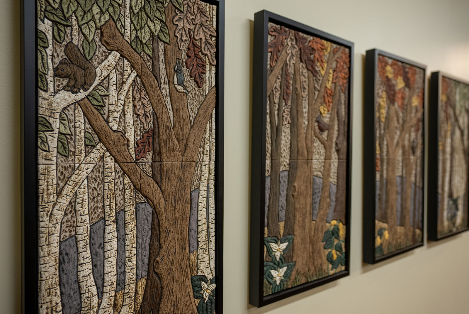 hallway with tree paintings
