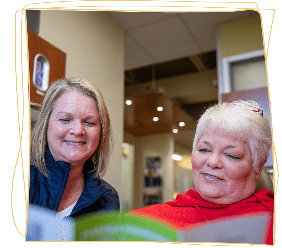 lady in red talking next steps dental implants