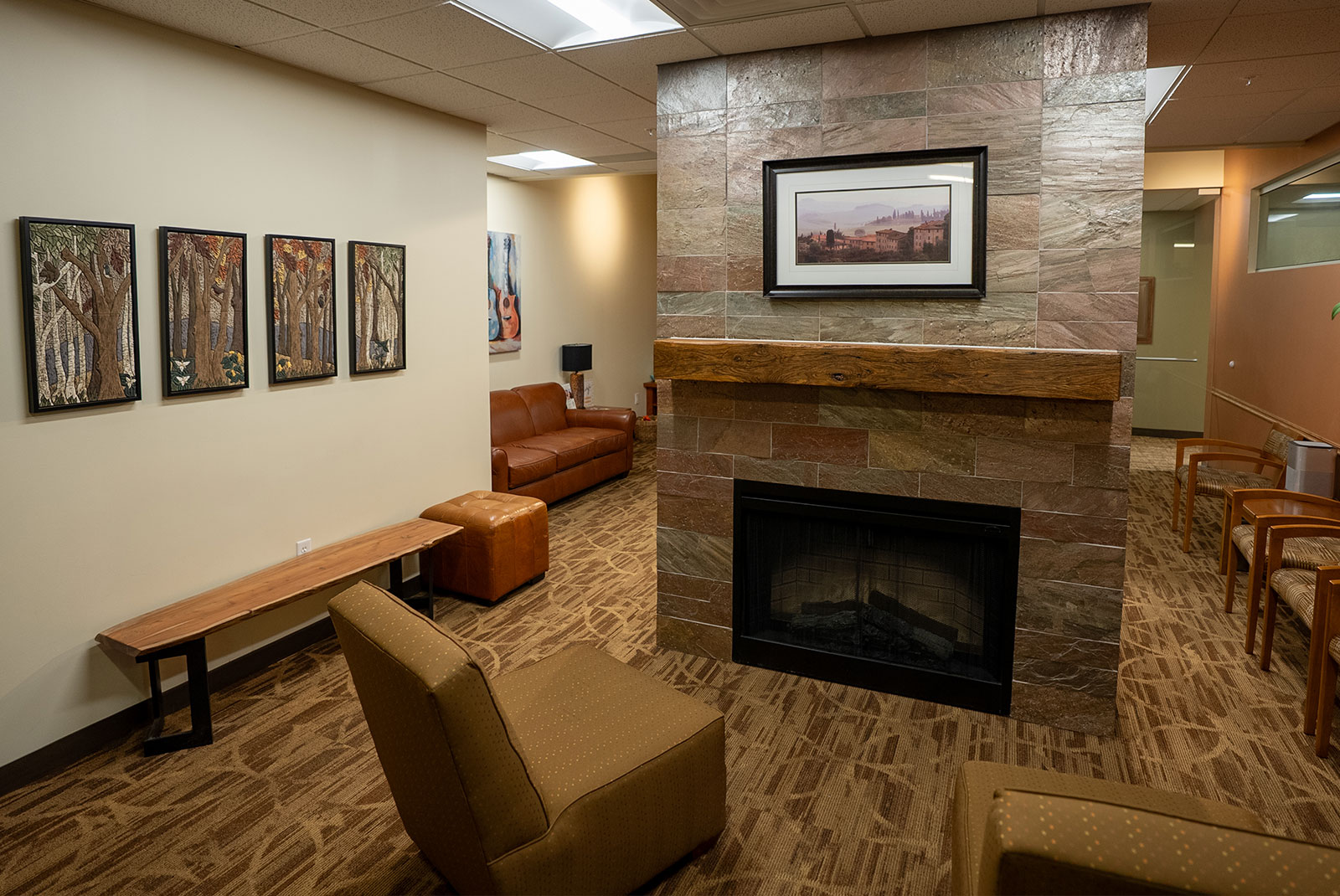 fireplace lobby forest paintings