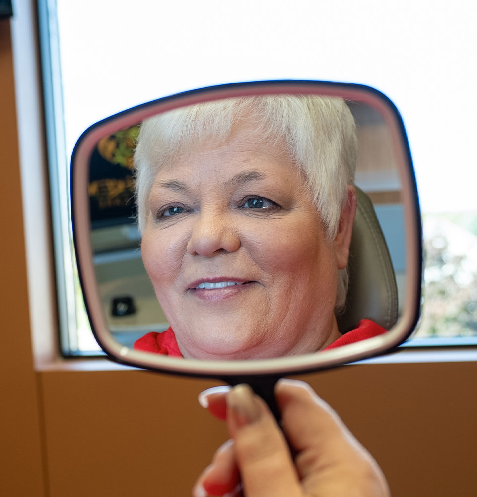 lady in red with new smile mirror mobile