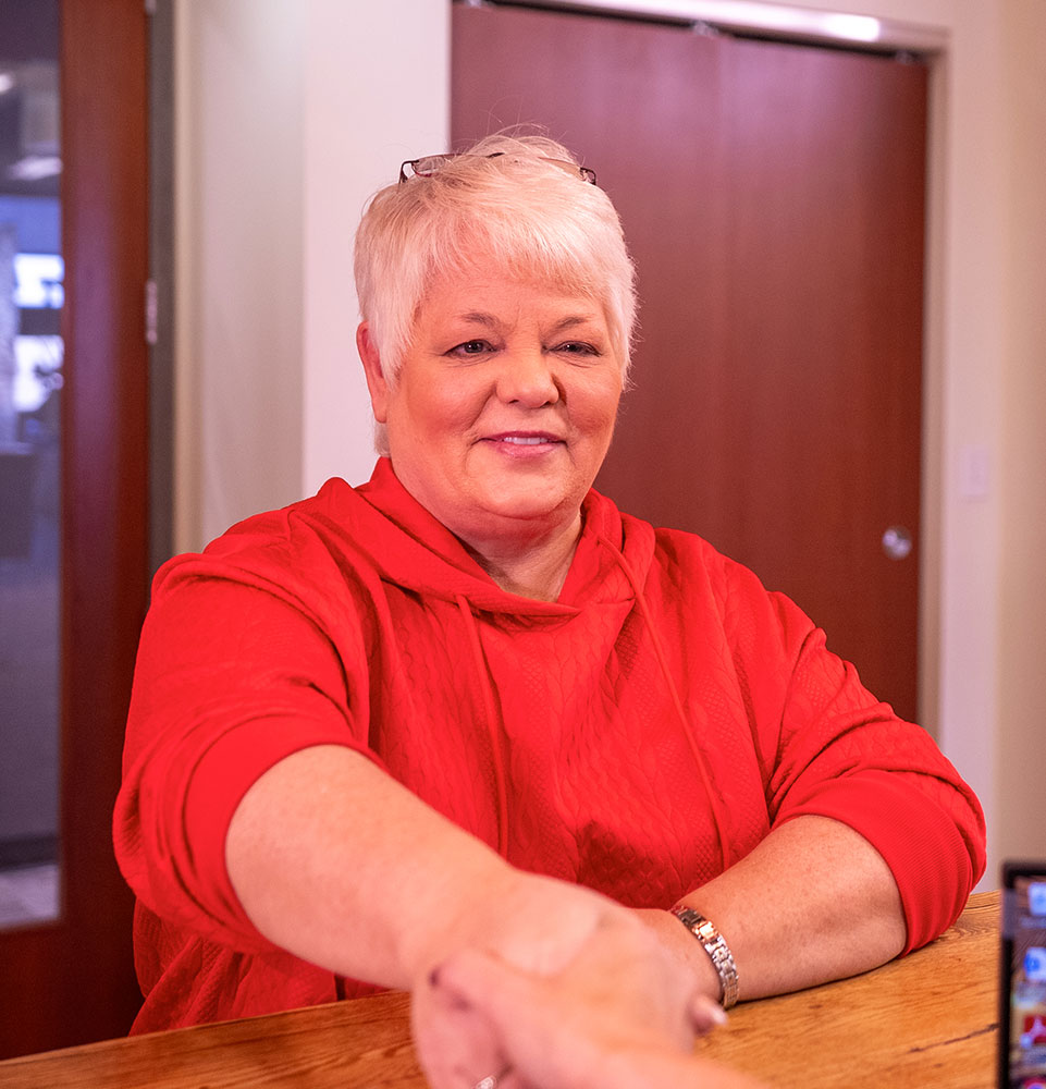 lady in red shakes being welcomed to practice