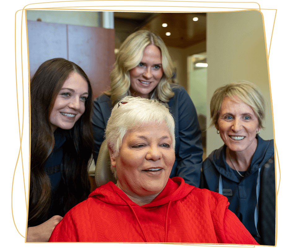 dental patient in red with team