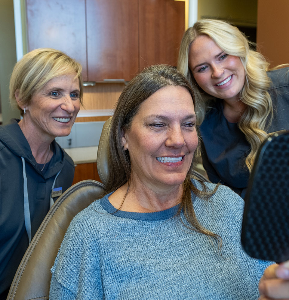 smiling today with her new dental implants