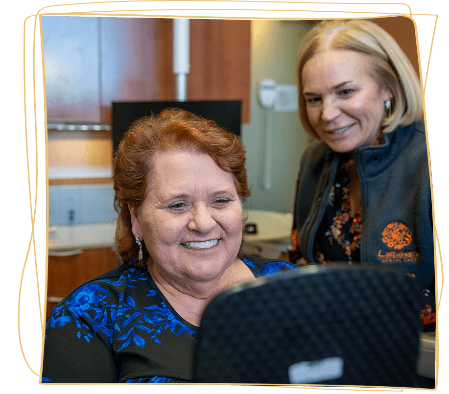 lady in black dress with her new dental implants